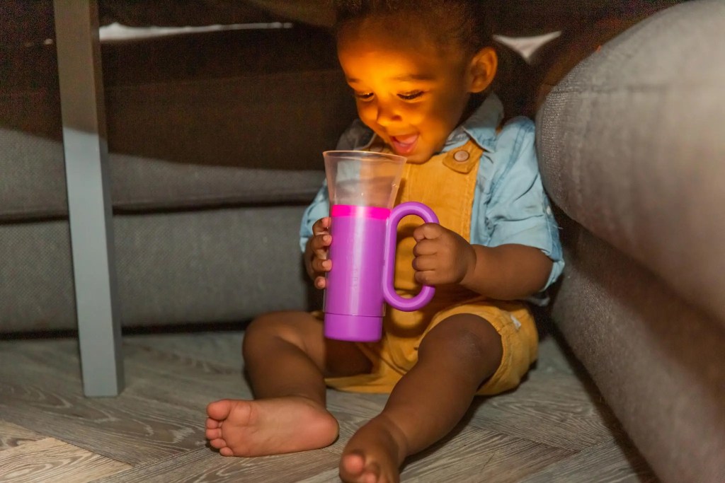 Child looking into the Really Real Torch from The Realist Play Kit