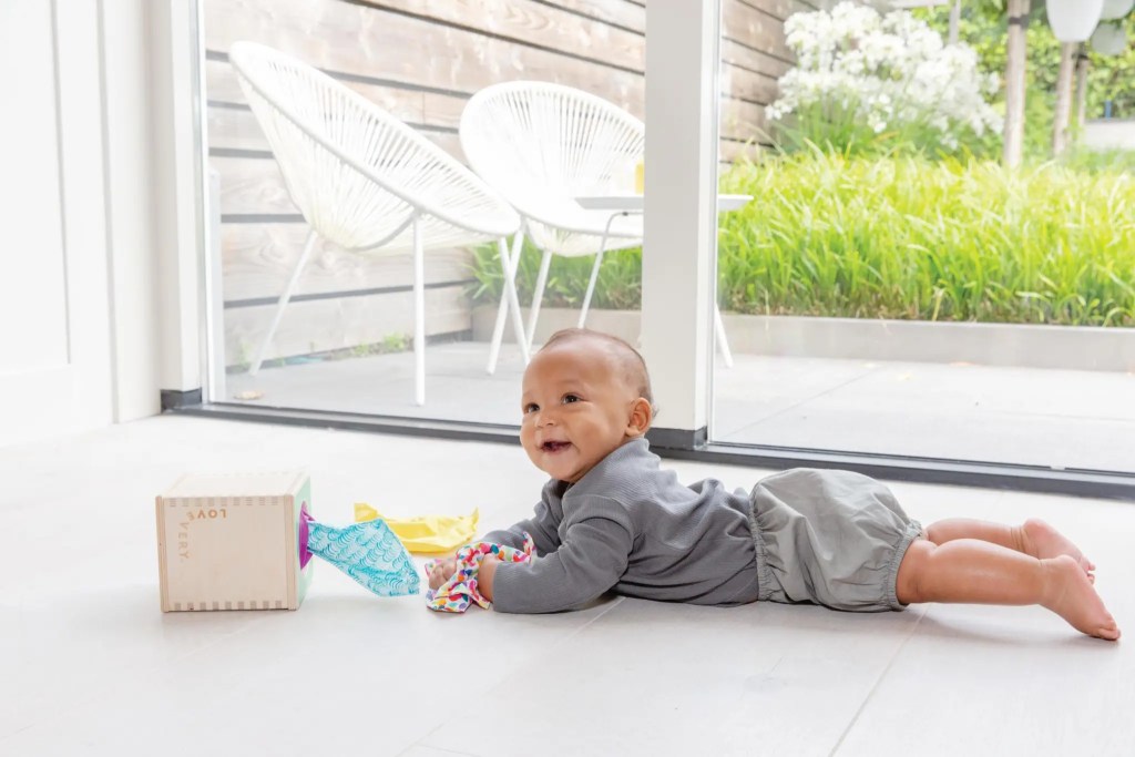 Child playing with the Magic Tissue Box from The Senser Play Kit