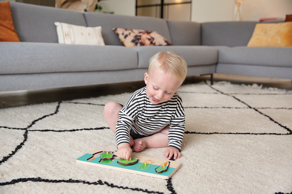 Child playing with the Garden Puzzle from The Adventurer Play Kit