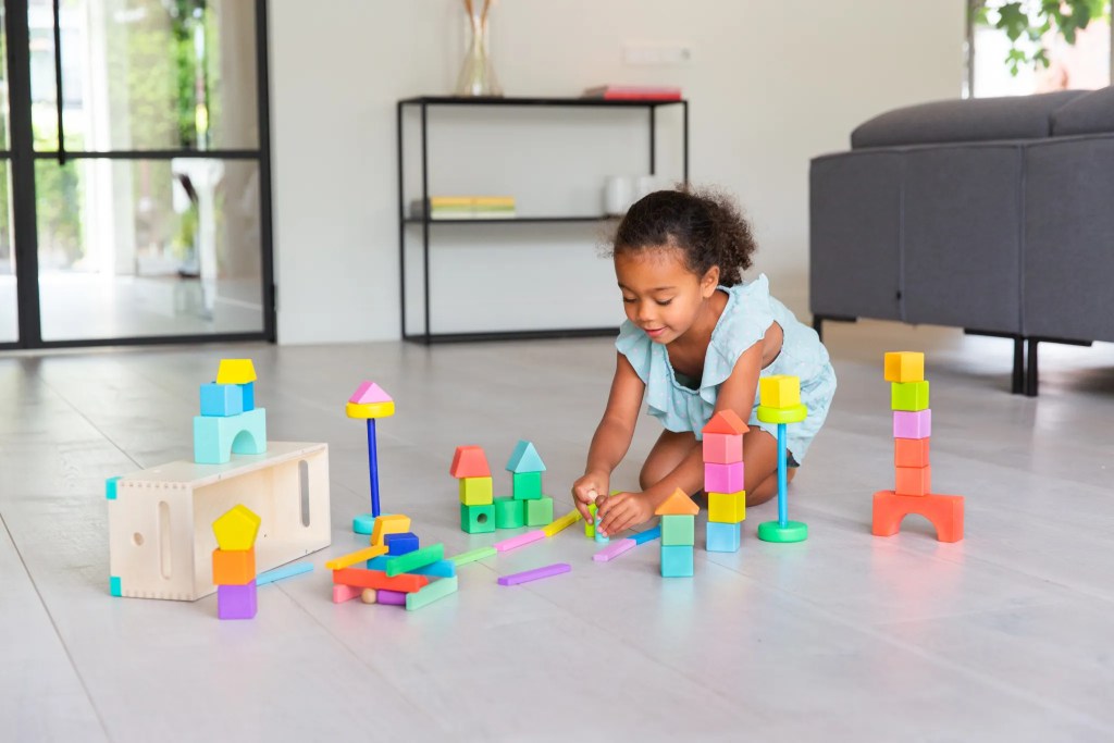 Child building with blocks from The Block Set by Lovevery