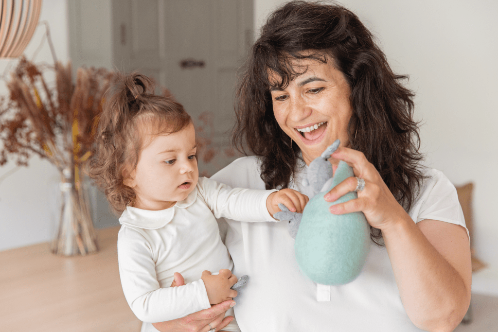 Mother and daughter playing with the Bunnies in a Felt Burrow from The Babbler Play Kit