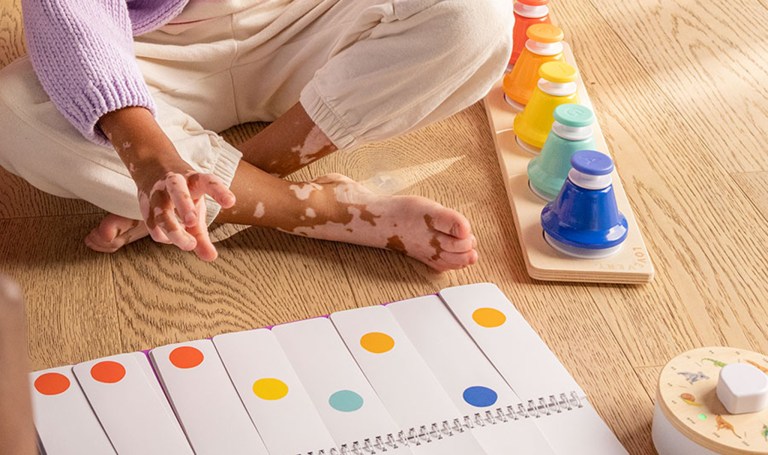 Child playing the Pat Bells from The Music Set